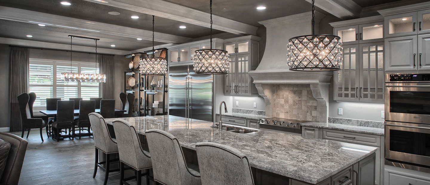 This luxury grey painted kitchen features an Omega Kitchen Hood finished in Limestone Open Cast